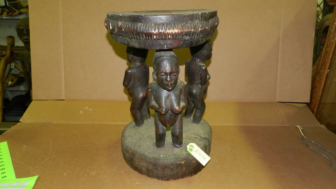 13038) African Caryatid Makonde carved stool supported: 13038) African Caryatid Makonde carved stool supported by three figures. From Tanzania. 17 1/2 x 12