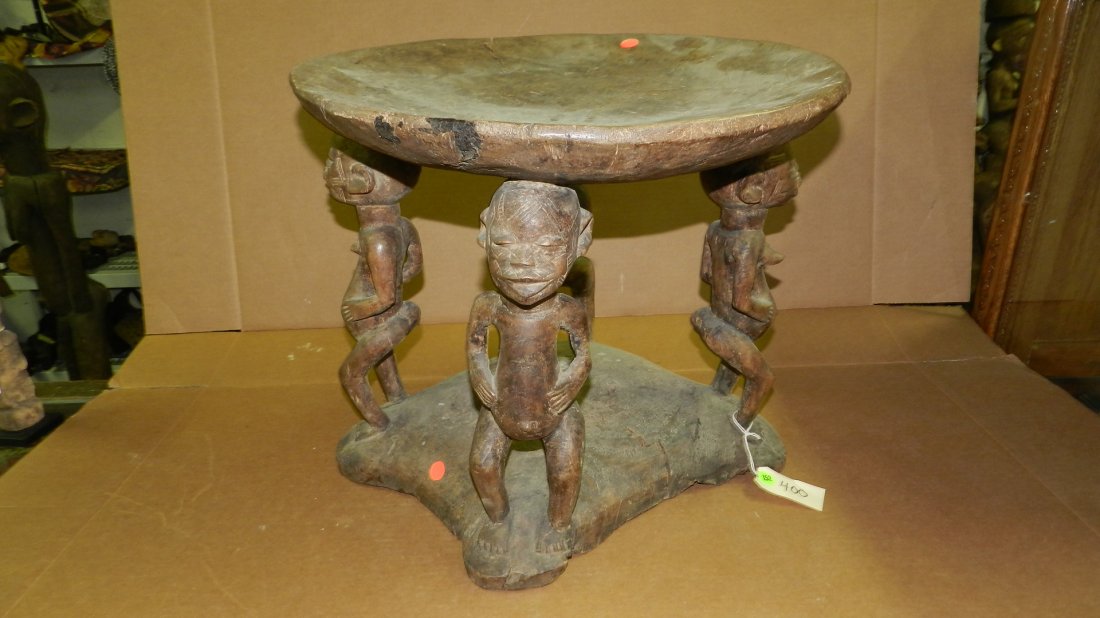 400) Large African carved Makonde 4-figured seat, 2 mal: 400) Large African carved Makonde 4-figured seat, 2 males, 2 females. Bottom not round. From Tanzania. 16 x 19