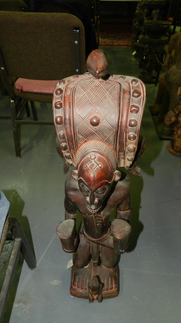 2441) Large African Chokwe statue holding 2 horns, repa: 2441) Large African Chokwe statue holding 2 horns, repairs to arm & coiffure. From DR Congo. 34"