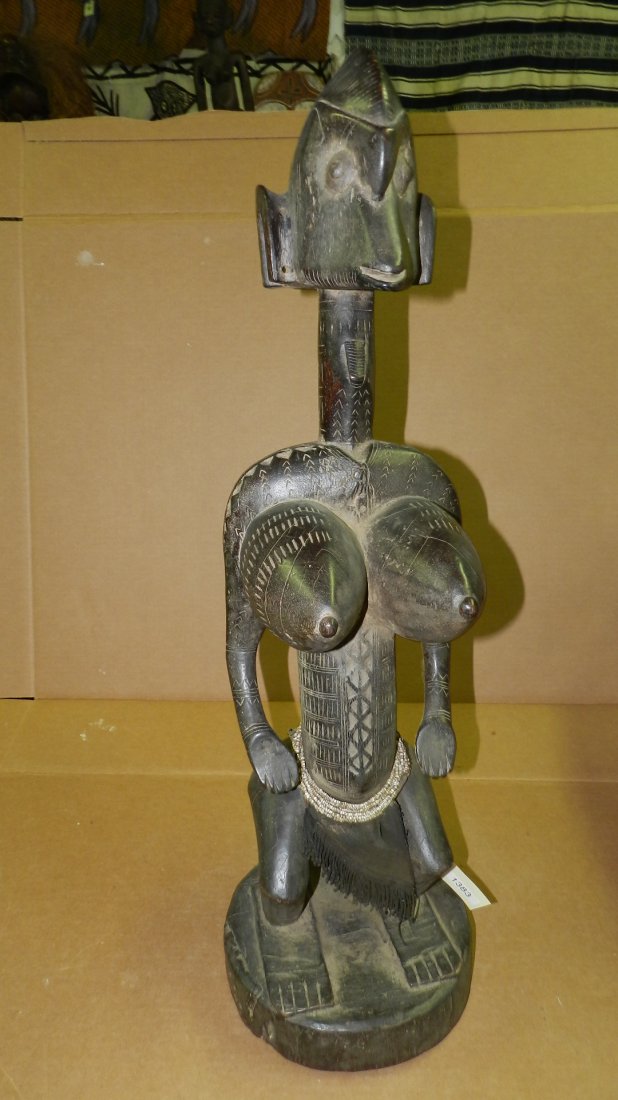 1383) Carved Squatting Dogon female figure on stand, Ma: 1383) Carved Squatting Dogon female figure on stand, Mali, 33" long