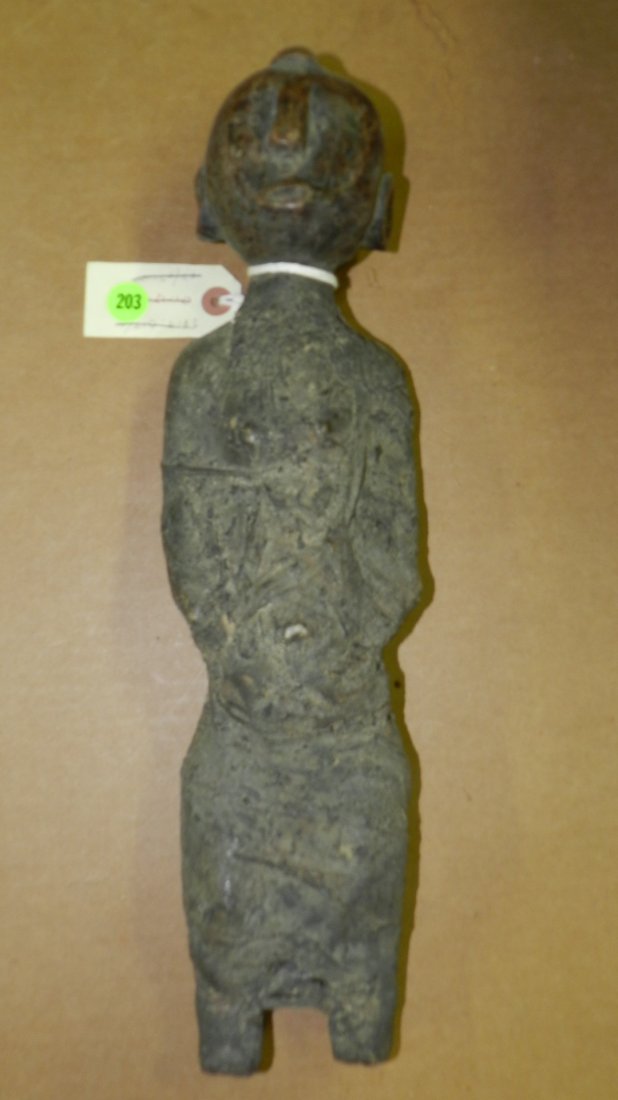 6044) Wrapped figure - East African. Wood with tightly: 6044) Wrapped figure - East African. Wood with tightly wrapped and soiled cloth and rope. In good condition, appropriate for age, origin, and mediums 15"