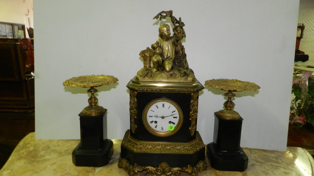 lovely 3 piece antique marble and bronze / brass: lovely 3 piece antique marble and bronze / brass figural clock set with 2 candle pillars, (depicting child picking /with grapes) cond VG, only missing back cover