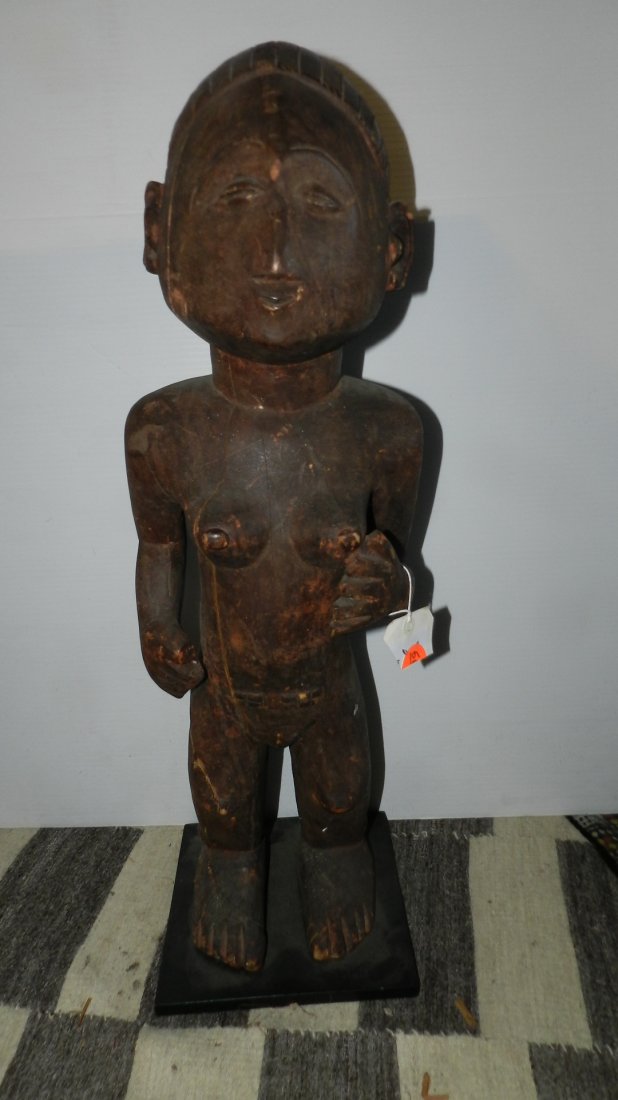 665) African carved Zande female ancestor figure; hand: 665) African carved Zande female ancestor figure; hand on breast. From DR Congo. 28" w/stand
