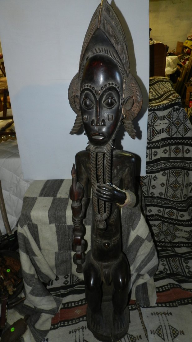 6644) African carved male figure from Ivory Coast. 60": 6644) African carved male figure from Ivory Coast. 60"