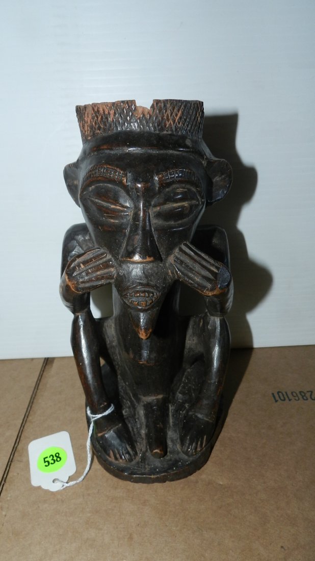 African carved Central African figural cup sitting male: African carved Central African figural cup sitting male figure holding cheeks, as found
