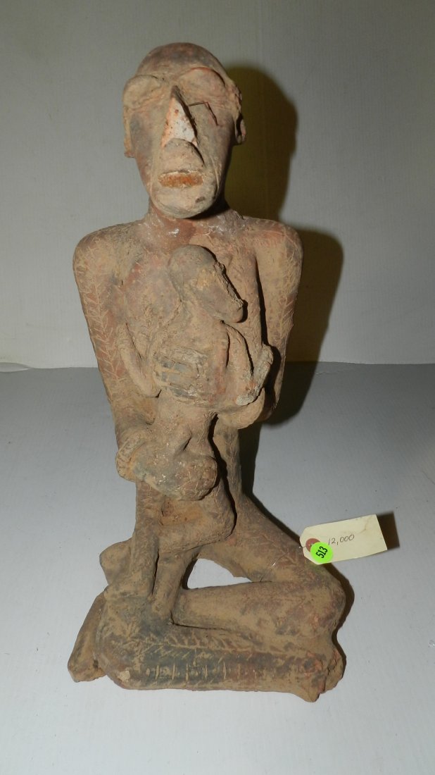 12000) African clay seated figure,: 12000) African clay seated figure,