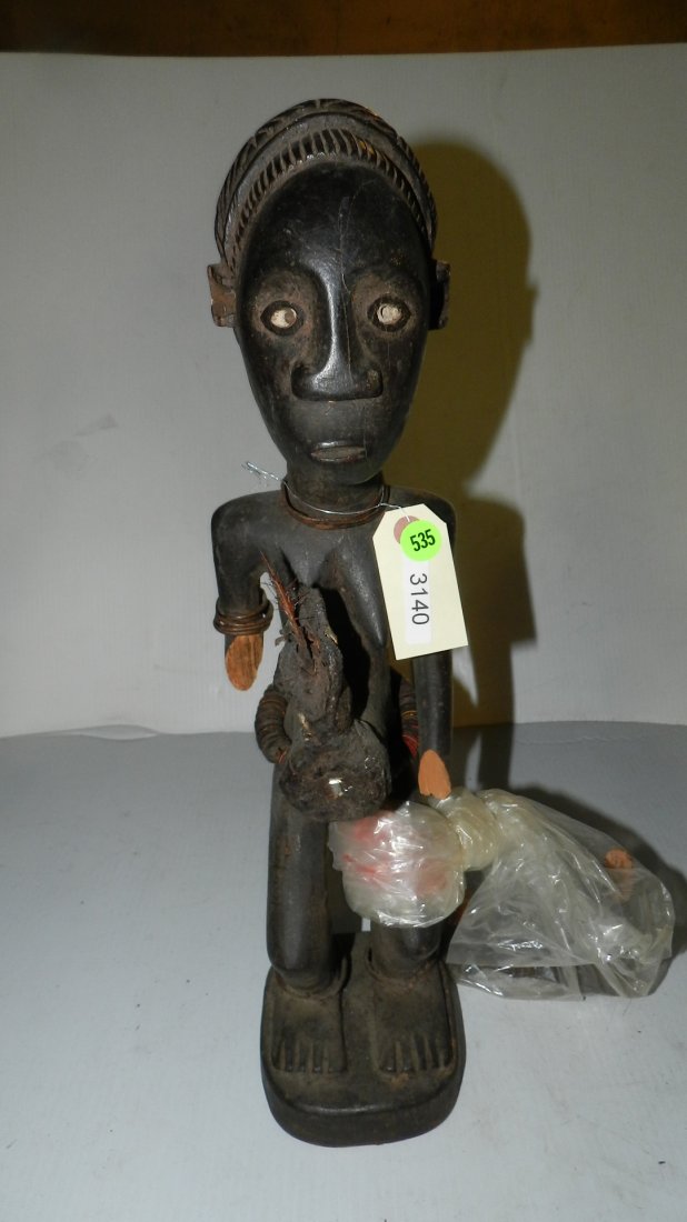 Central African standing female figure with fetish cha: Central African standing female figure with fetish chambers front and back. Repaired broken arms. 20 1/4