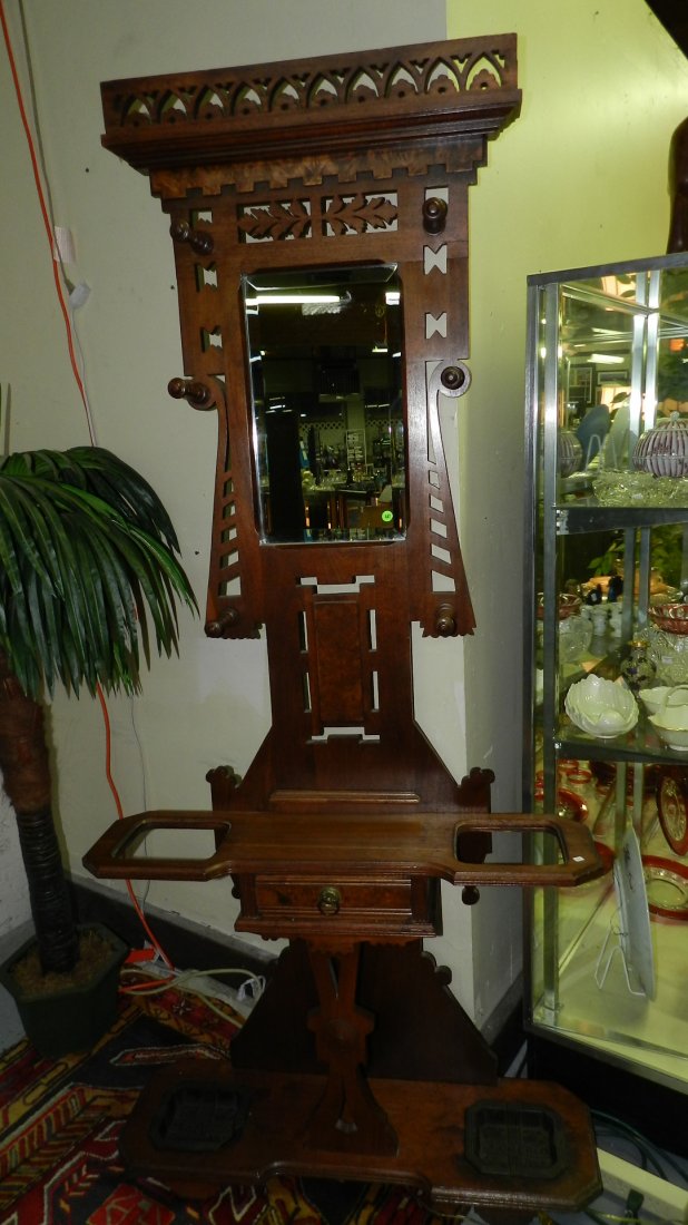 Outstanding antique Eastlake carved hall tree with: Outstanding antique Eastlake carved hall tree with mirror and drawer. COND VG. Minor chip in umbrella tray. Special shipping required.