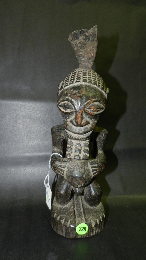 Vintage African carved figure with horn: Vintage African carved figure with horn