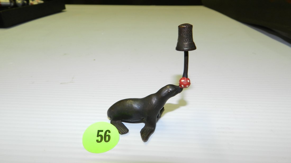 Unique, Vintage cast bronze thimble holder with Seal &: Unique, Vintage cast bronze thimble holder with Seal & red ball. COND VG
