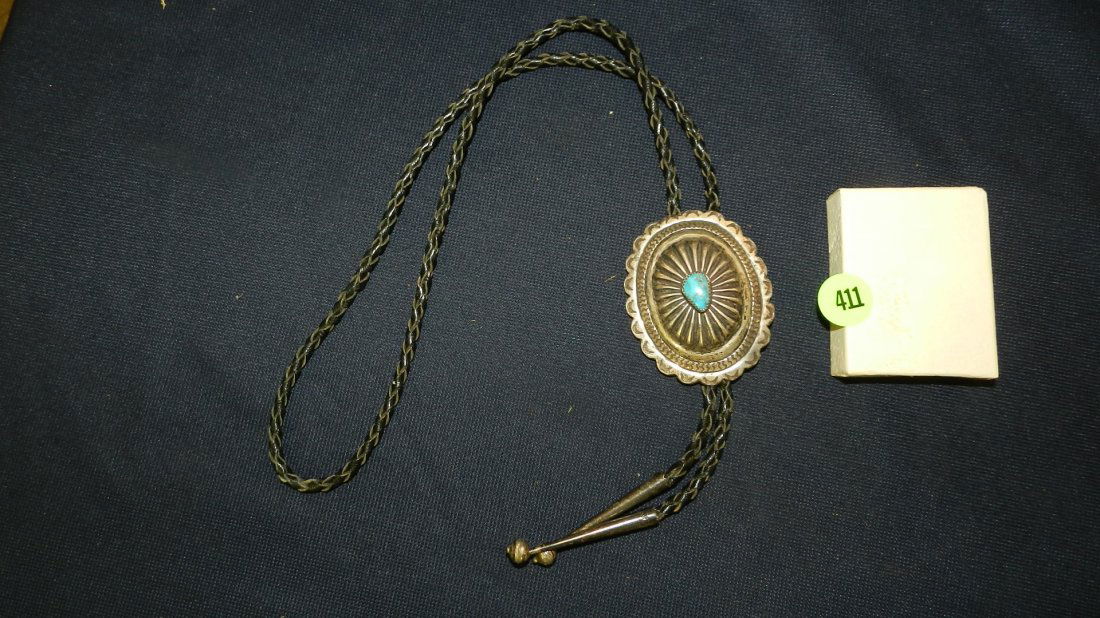 vintage Native American pawn silver and turquoise bolo: vintage Native American pawn silver and turquoise bolo with leather strap and silver caps, signed Bennett, cond VG
