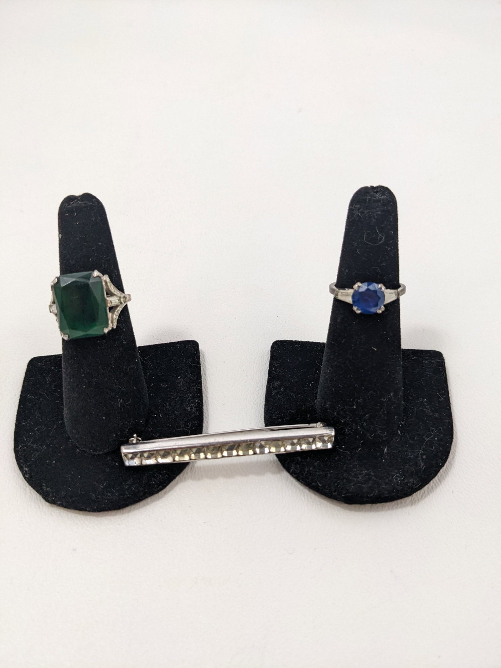 Sterling Rings and brooch: two rings size size 6.5 and a bar brooch.