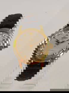 1956-57 Omega Seamaster 14KT Gold  Watch: Omega Seamaster 14KT gold watch with Omega signed leather band. All measurements approximate: 35mm case, 18mm lug width. 42mm lug to lug. 10mm thickness.Winds and runs. Caliber 500 movement, manufactu