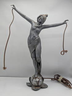 A bronzed spelter figural table lamp, Woman with Outstretched Arms: Bronzed spelter figural table lamp, Woman with Outstretched Arms. Right hand pinky missing. Antique Art Deco, 13 x 19.5"