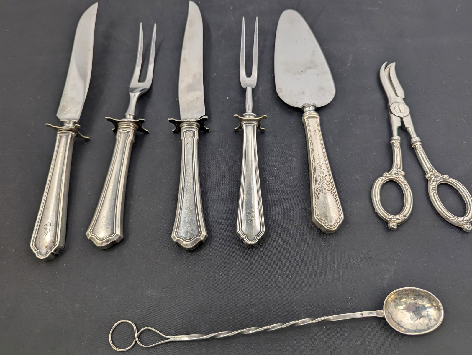 Six serving pieces, all with sterling handles, and one sterling ice tea spoon.  16 grams. (1 of 7)