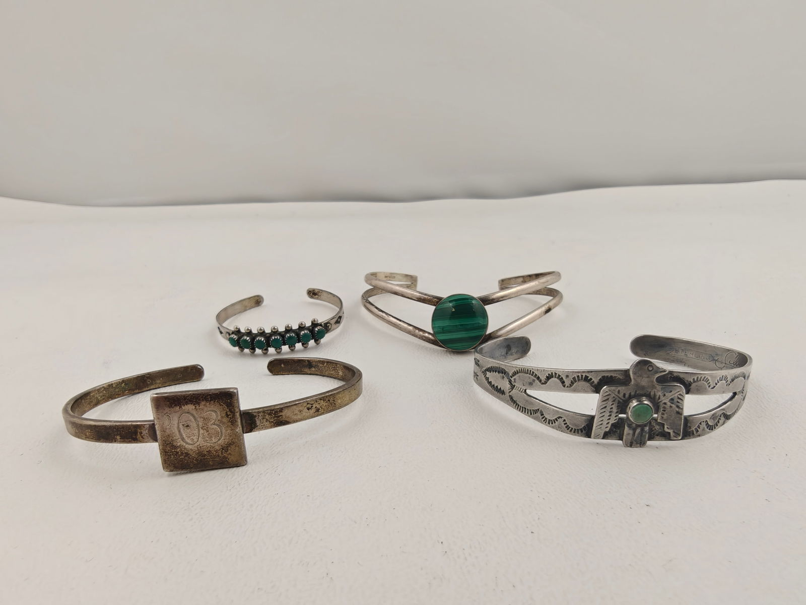 4 Sterling Cuff Bracelets weight 47 g including stones: 4 Sterling Cuff Bracelets, including 1 Child's Bracelet with Turquoise.Total lot weight 47g including stones