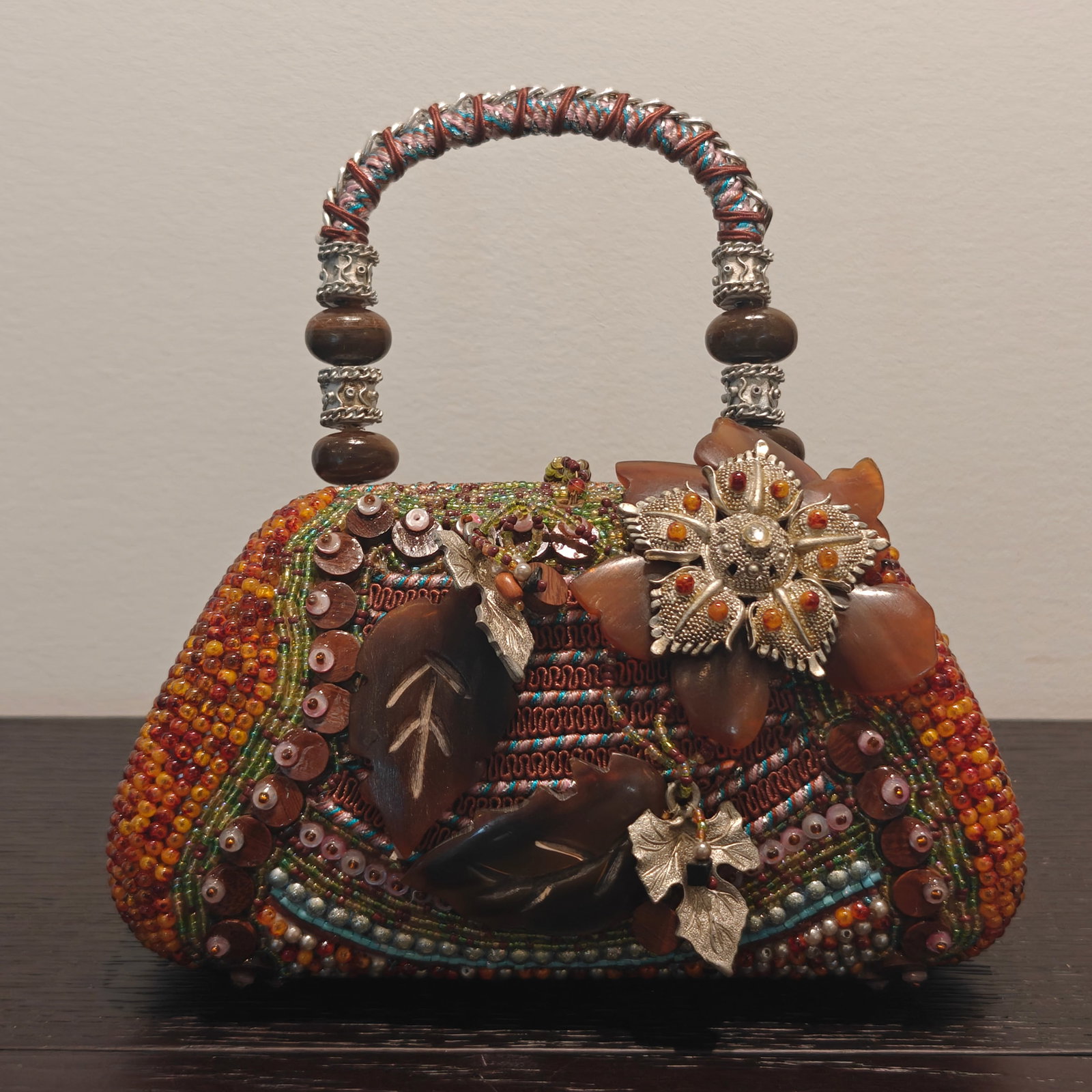 Mary Frances Beaded Satchel Handbag with Floral and Leaf Motif: Exquisite Mary Frances designer satchel handbag, richly decorated with multicolor glass beads, carved stone and bone embellishments, and ornate silver-tone floral and leaf appliqués. The bag features