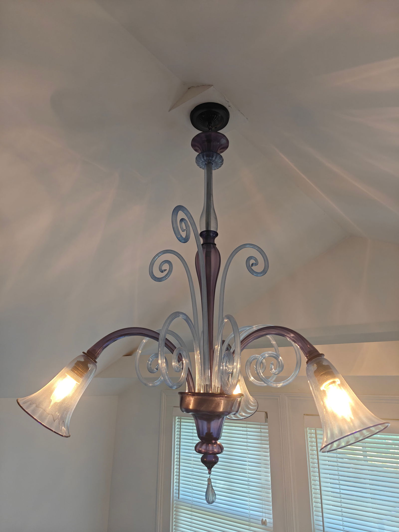 Attributed to Venini Murano Three-Arm Glass Chandelier: Elegant Murano glass chandelier attributed to Venini, featuring three arms of clear and lavender-toned glass with scrolling decorative elements and bell-shaped shades. The piece reflects the refined c