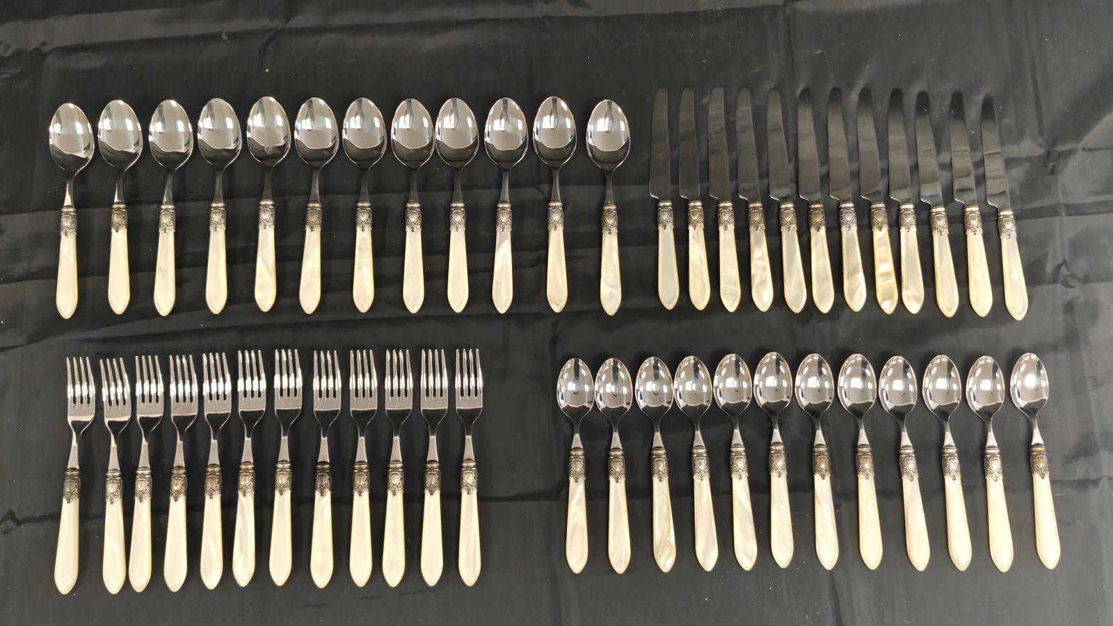 Vintage Bugatti “Oxford?? Faux Mother of Pearl Flatware Set – 48 Pieces (12 Place Settings) –: Vintage Bugatti flatware set in the Oxford pattern, featuring faux mother-of-pearl handles with decorative metal collars. Marked Bugatti Italy 18/10. Set includes 12 complete 4-piece place settings: