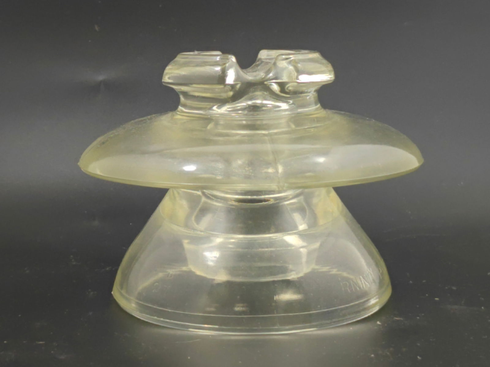 Pyrex Clear Glass Insulator, Large Size: Clear molded glass electrical insulator by Pyrex. Large example with stepped form and threaded interior. Marked PYREX. Approximate dimensions: 8 inches wide x 5 inches tall. Good overall condition