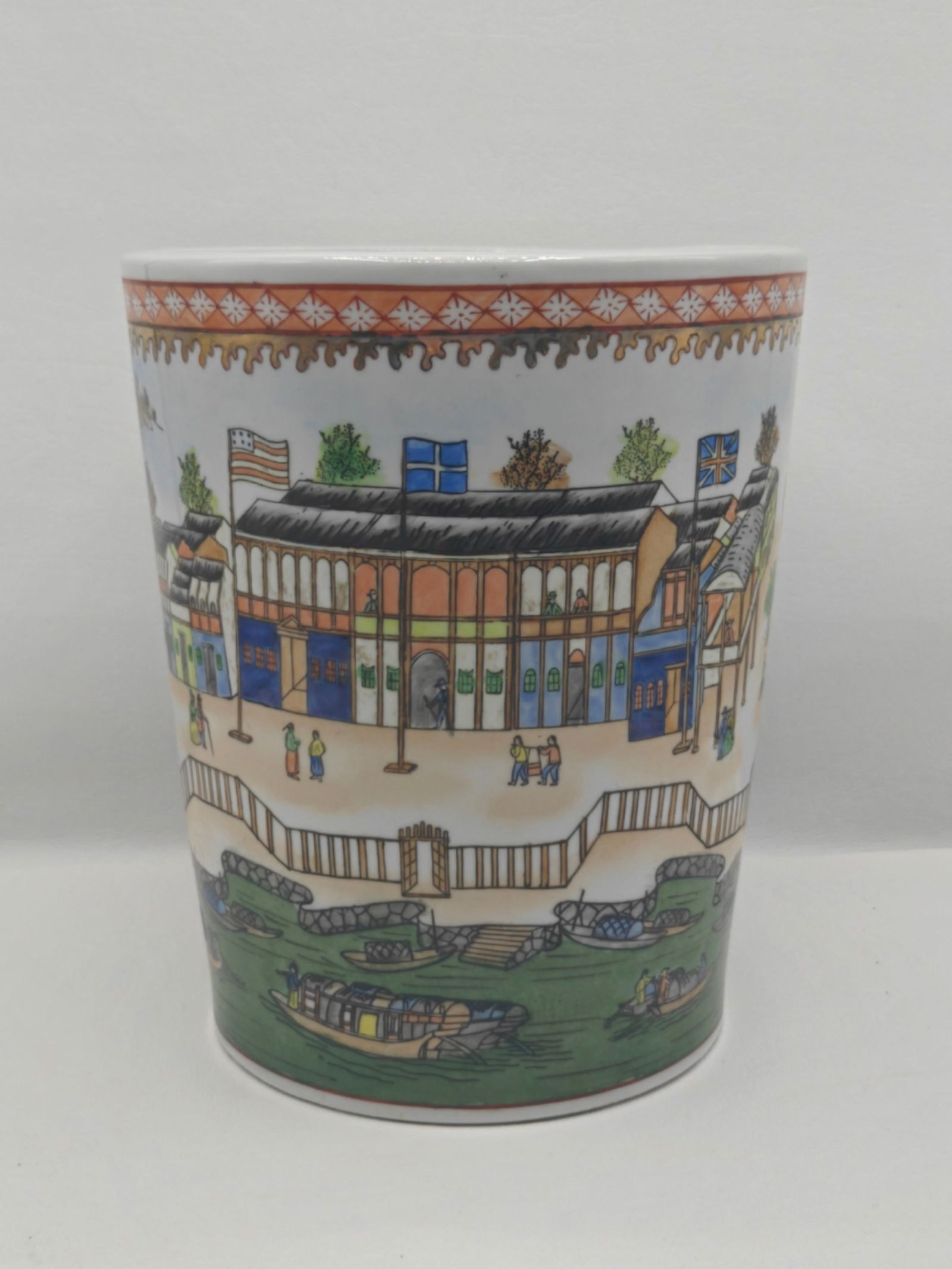 Chinese Porcelain Jar with Figural Landscape Decoration: Chinese porcelain jar decorated with a continuous figural landscape scene depicting buildings, figures, and boats along a waterfront. The design is rendered in polychrome enamels with an ornamental bo