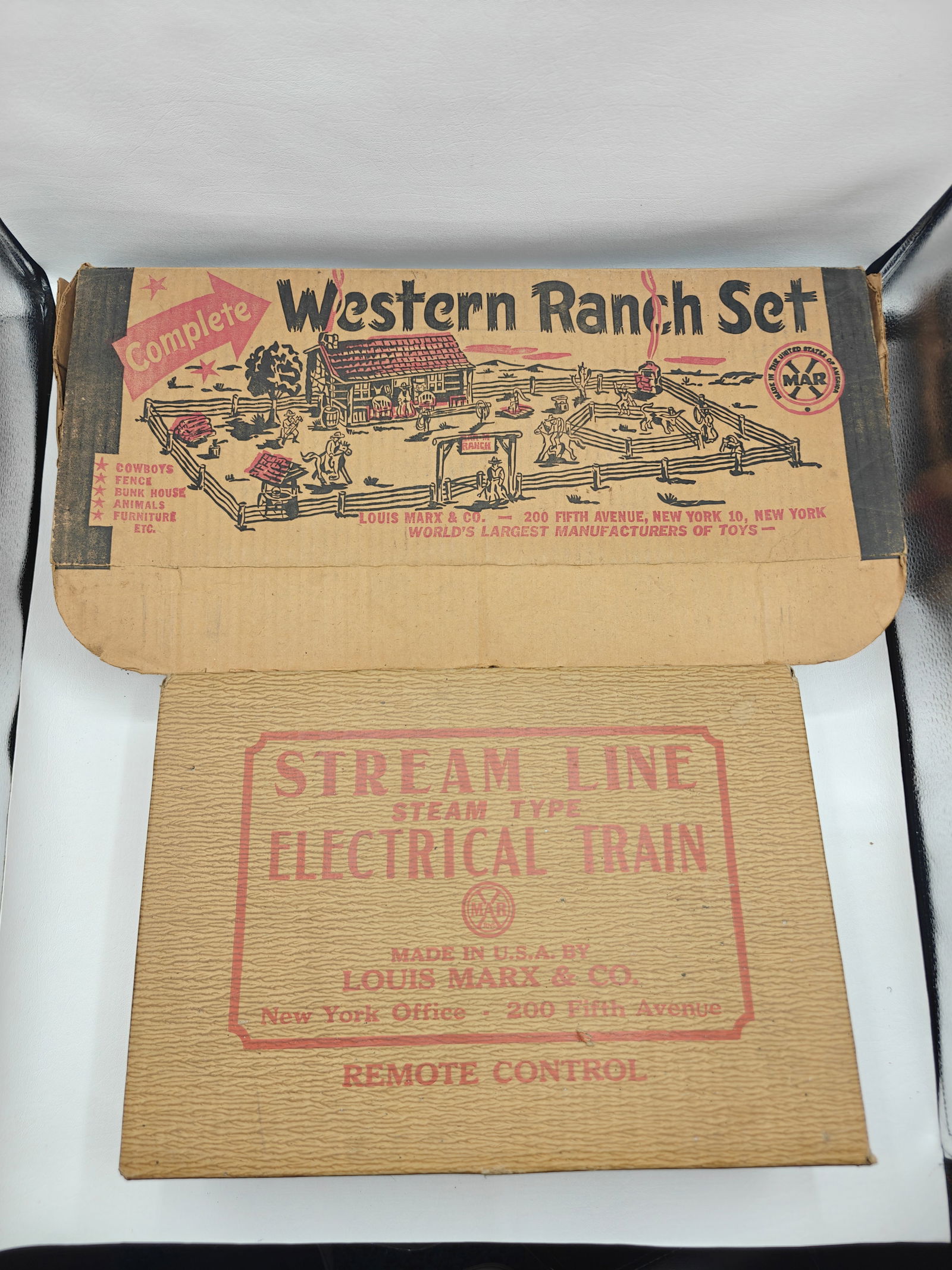 Louis Marx & Co Stream Line Electrical Train Set with Tracks and Accessorie: Louis Marx & Co tin litho stream line electrical train set with engine, two open box cars, and tanker car. Includes original transformer, remote control, crossing signals, and a large quantity of trac