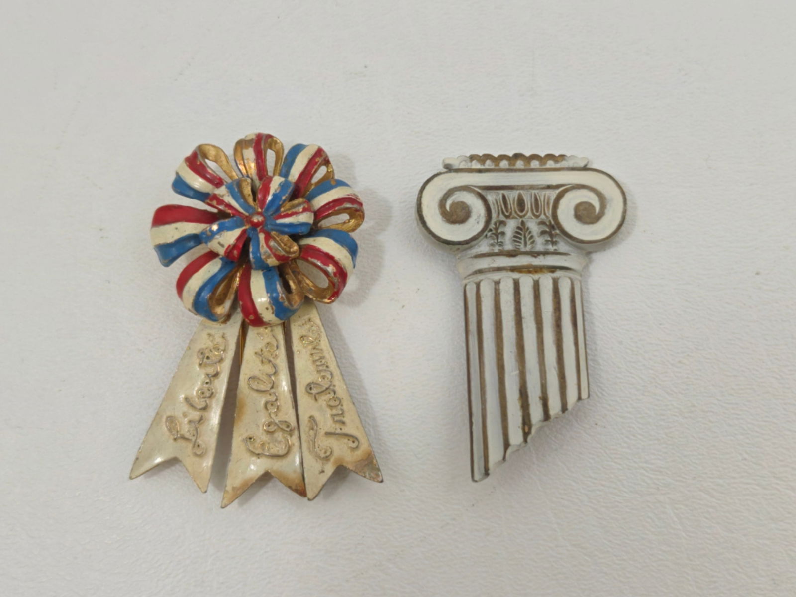 Silson French patriotic tricolor cockade fur clip brooch with bonus architectural column pin: Vintage WWII-era French patriotic cockade fur clip by Silson featuring red white and blue enamel ribbon design with gilt metal, engraved “Liberte Egalite Fraternite,” marked Silson with patent