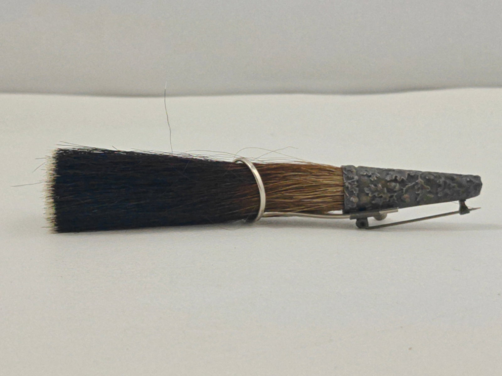 Austrian garmsbart alpine hat brush plume pin with metal holder: Traditional Austrian garmsbart brush plume used for alpine or Tyrolean hats featuring natural hair bristles secured in a textured metal cone mount with pin and screw fitting for attachment