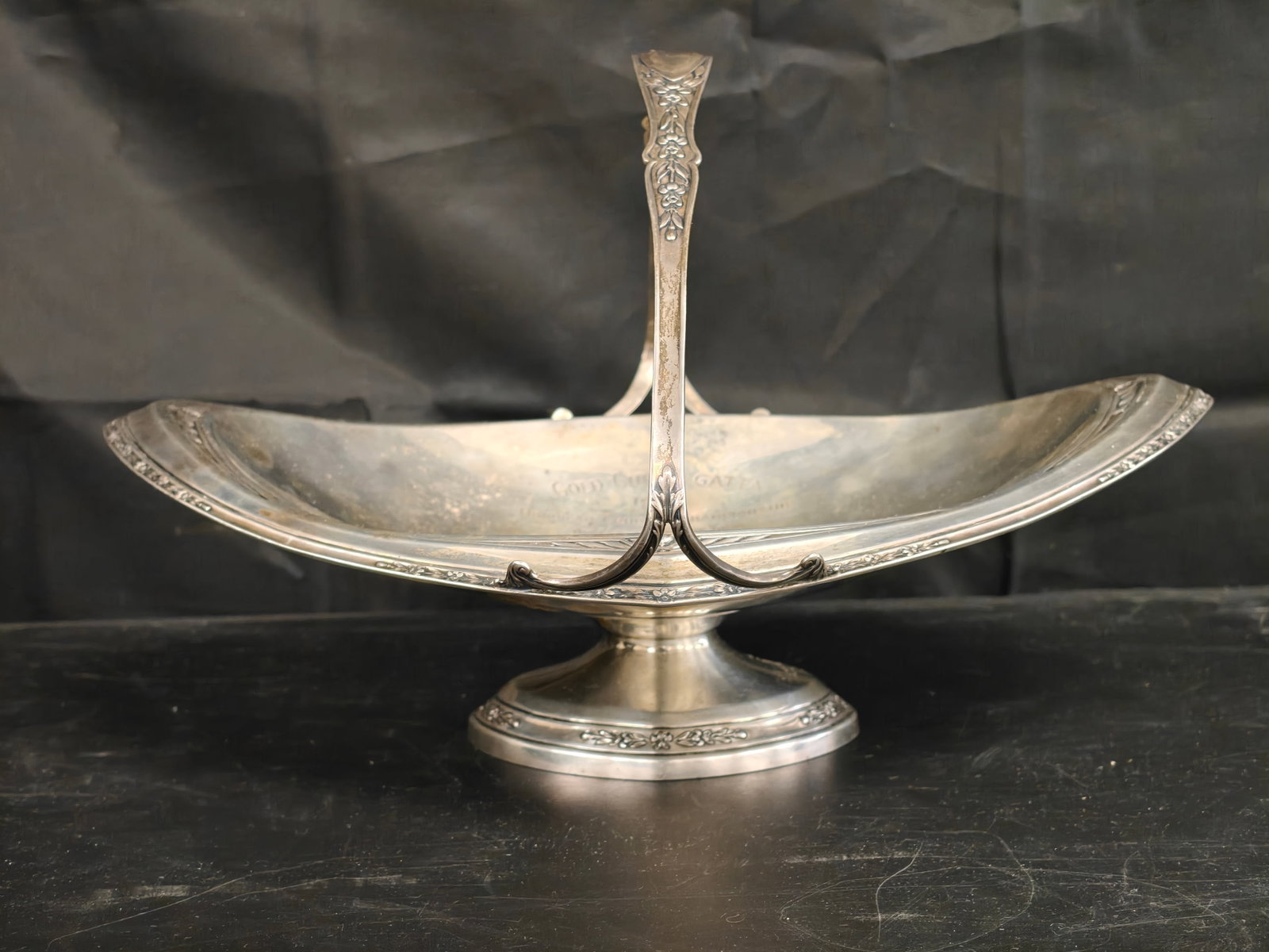 Wallace Sterling Silver Gold Cup Regatta Presentation Basket, 1925: An exceptional Wallace sterling silver presentation basket commemorating the 1925 Gold Cup Regatta, one of the premier American yachting events of the early twentieth century. Elegantly formed with a 