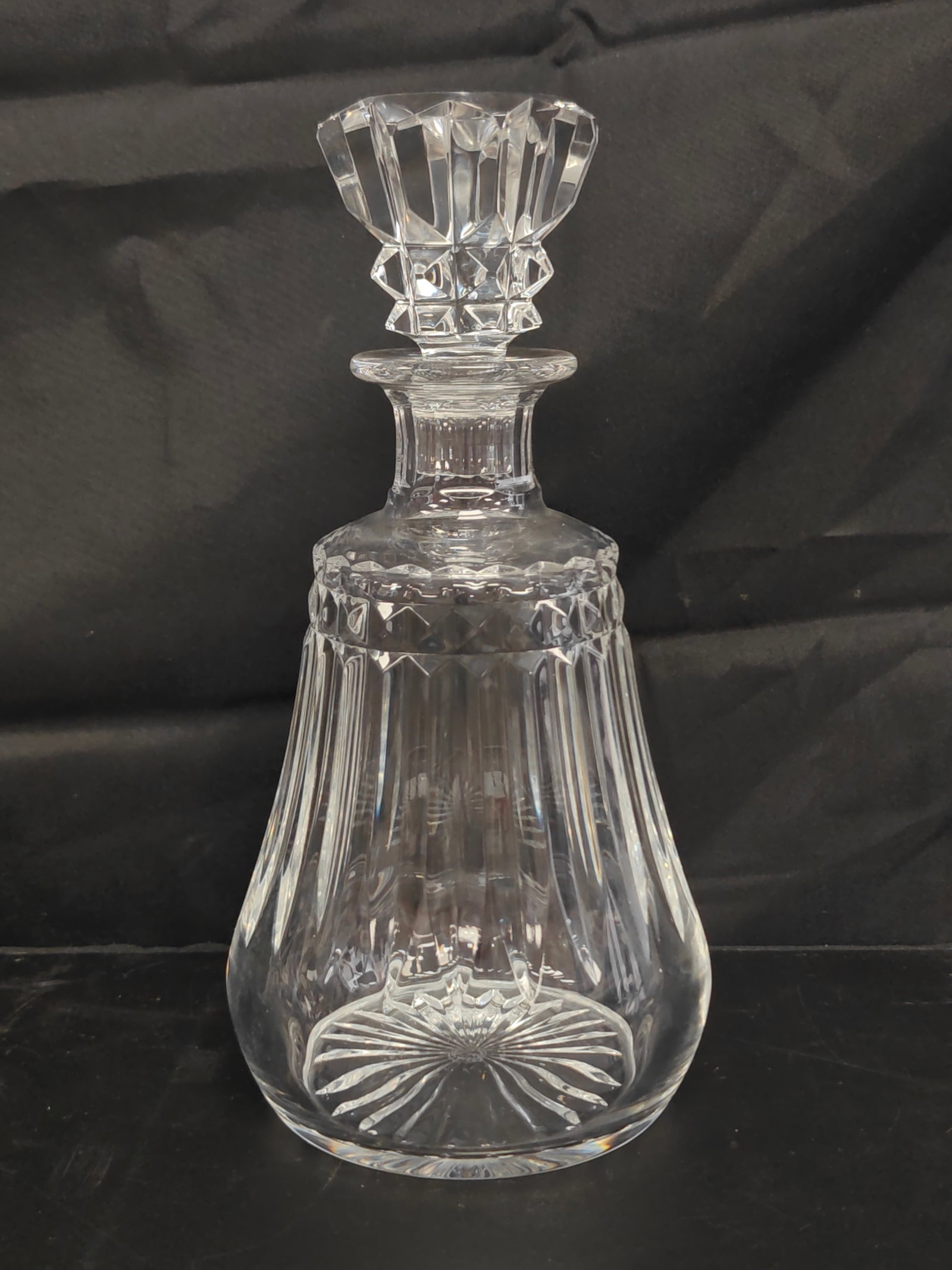 Baccarat Piccadilly Crystal Decanter: Baccarat "Piccadilly" pattern lead crystal decanter with its original faceted stopper. The elegant form features vertical fluting, a band of diamond cutting at the shoulder, and a radiating starburst 