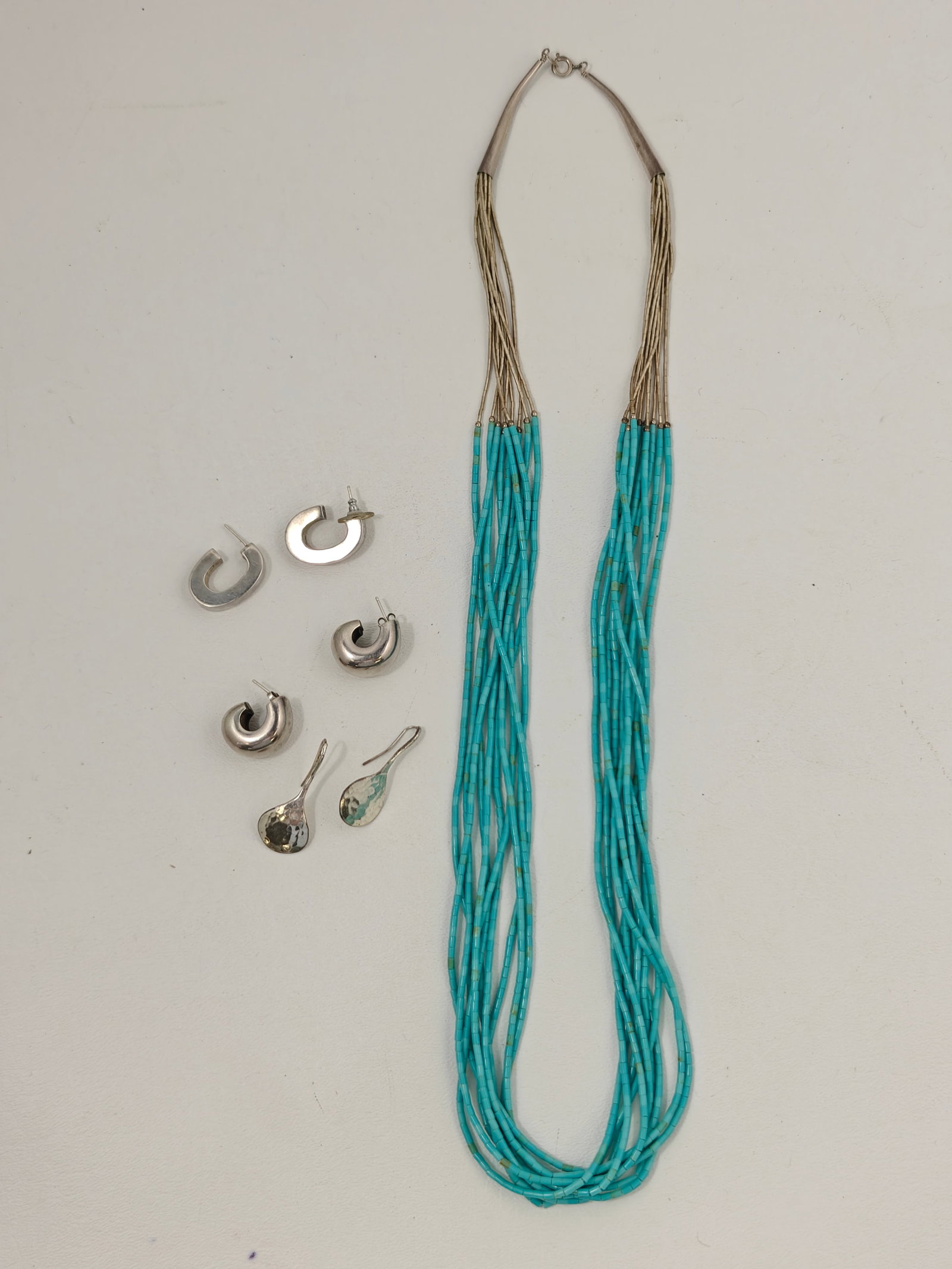 Native American Style Turquoise Heishi & Liquid Silver Necklace with Sterling Silver Earrings: Collection including a Native American style ten-strand turquoise heishi and liquid silver necklace together with three pairs of sterling silver earrings. The necklace features turquoise-colored heish