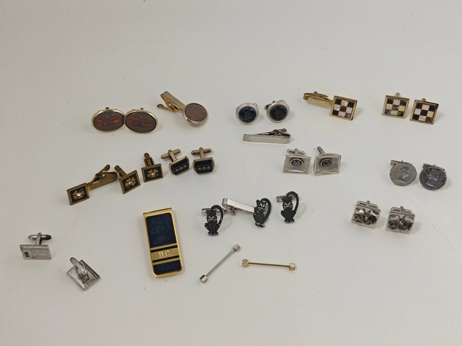 Large Collection of Vintage Cufflinks, Tie Clips & Collar Bars: Large collection of vintage men's dress accessories including approximately ten pairs of cufflinks, five tie clips, and three collar bars. Features include mother-of-pearl and abalone checkerboard mos