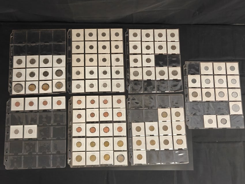 Collection of Approximately 36 Circulated Canadian Coins: Collection of approximately 36 circulated Canadian coins housed in 2x2 cardboard holders and archival binder pages. Includes an assortment of Elizabeth II coinage spanning the mid-20th century through