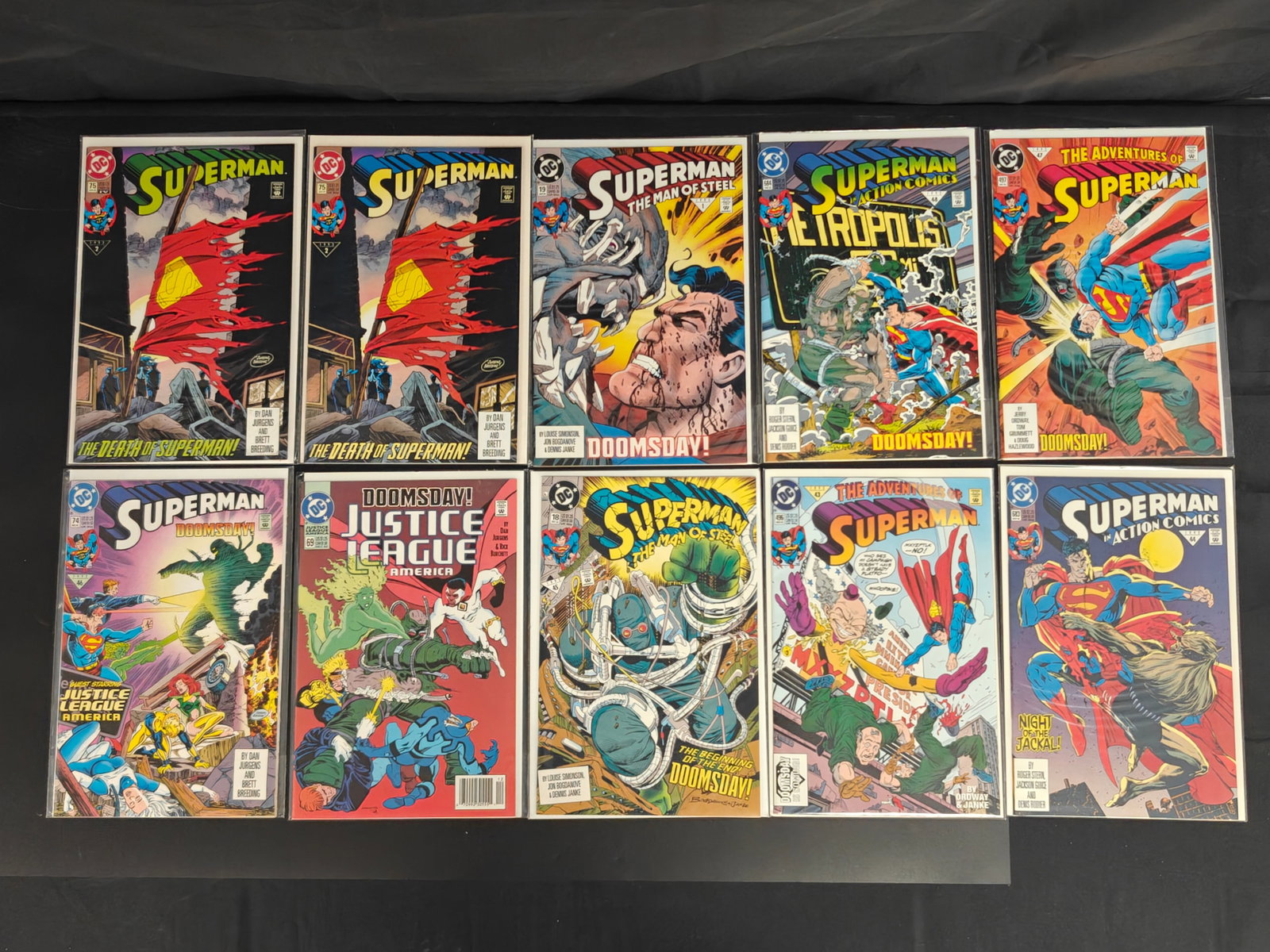Death of Superman Comic Lot, Superman #75 and Doomsday Issues: Group lot of 1990s DC Death of Superman and Doomsday-related comic books, including two copies of Superman #75, Superman #74, Superman: The Man of Steel #18 and #19, Action Comics #683 and #684, Adven