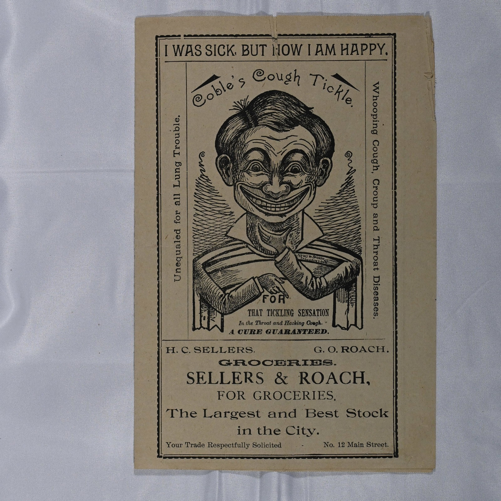 Coble's Cough Tickle / I was sick, but now I am happy: A local advertiser. At left shoulder of man in fine print: News & Banner Frankfort Ind, likely the printer. Advertising for Coble's Cough Tickle front and inside. Front panel features Sellers & Roach 
