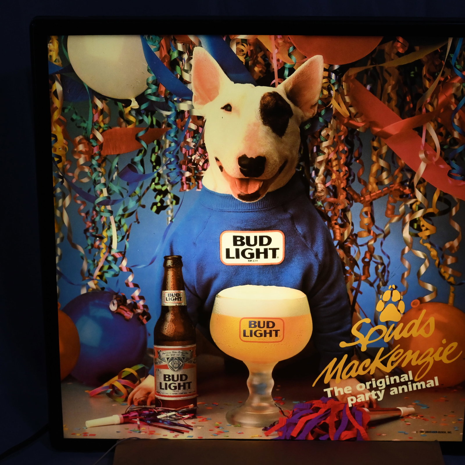 Bud Light - Spuds MacKenzie Light Wall Beer Sign: Spuds MacKenzie The original party animal . Paper label Anheuser Busch Inc St Louis MO USA. Date stamped Jul 26 1988. Manufactured by KCS Industries Inc. About 18 H x 18 W x 4.5 D inches.
