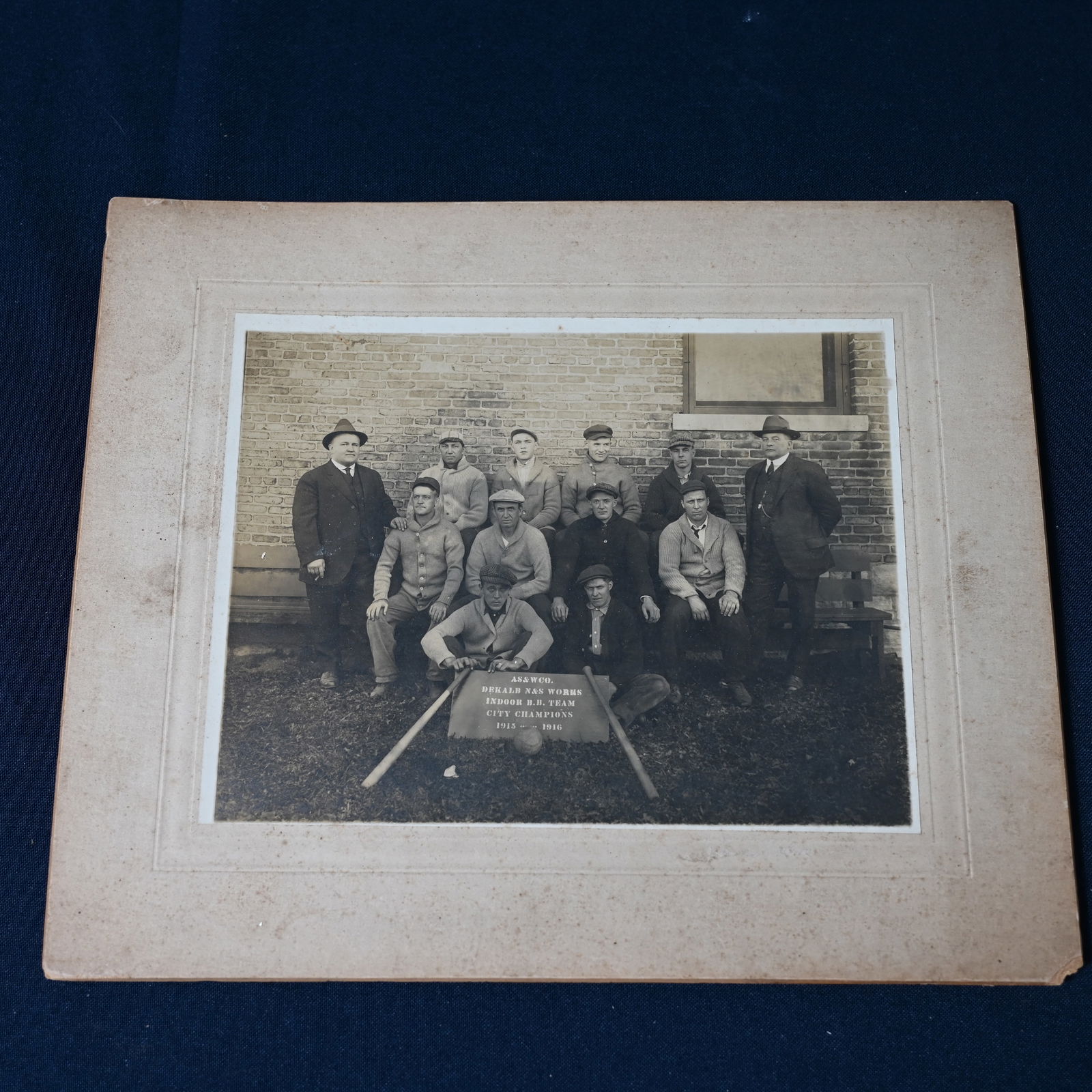 Baseball Team Photograph DeKalb Illinois City Champions 1916: AS&WCO likely refers to the American Steel & Wire Company which operated in DeKalb Illinois 1898 - 1938. It acquired I.L. Ellwood Manufacturing Company in 1898, a local barbed wire manufacturer. We