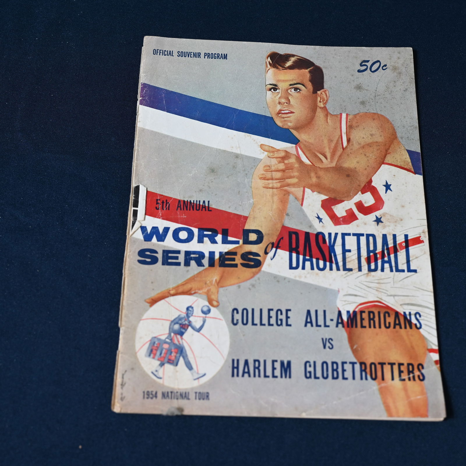 5th Annual World Series of Basketball - 1954 National Tour: College All-Americans vs Harlem Globetrotters - March 28 through April 17 1954 Coast-to-Coast via United Air Lines Mainliner The Globetrotter. We photographed the contents. The centefold featuring