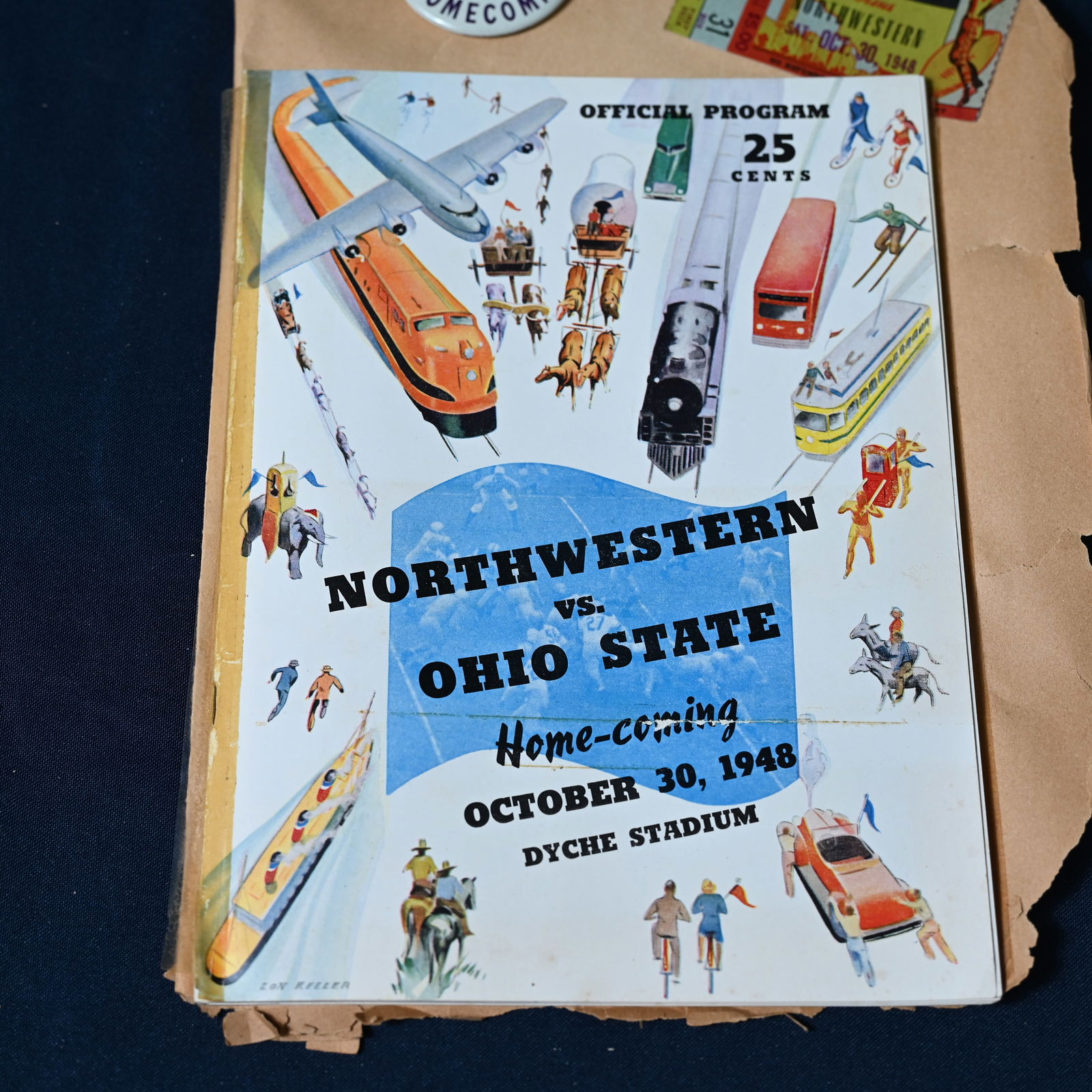 Northwestern vs Ohio State Football Game October 1948 - Lot of 4: Northwestern's Homecoming Game played October 30, 1948. Lot includes (1) program taped to a scrapbook page, (2) partial ticket also taped to the page, (3) a pin that is loose, and (4) an invitation