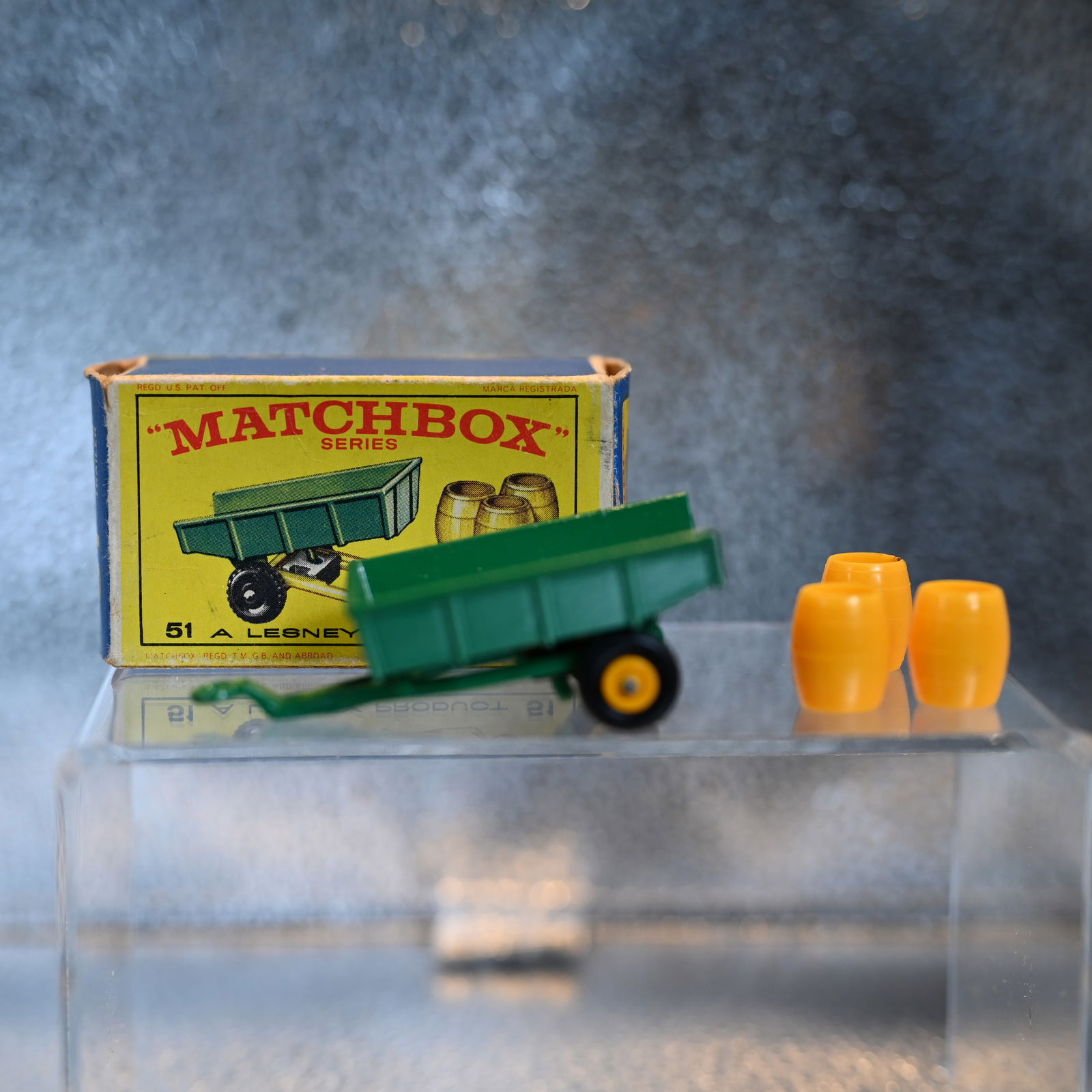 Matchbox Series No 51 - Tipping Trailer: Marked: Behind axle, No 51 Matchbox Series. And, under the tongue - which lifts to tilt the trailer, Trailer - Made in England - By Lesney
