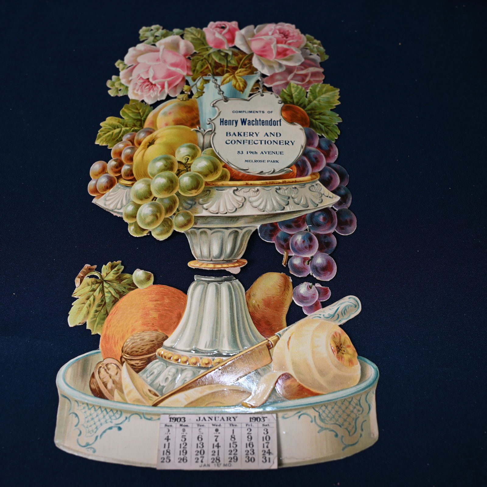 4 - Die Cut Floral Calendar: Lot of 4 - (a) the largest about 15 3/4 H x 8 1/2 W, a vase with flowers for Henry Wachtendorf is separated / torn apart at the base of the bowl. In our opinion, it can be repaired. Hole at top, origi