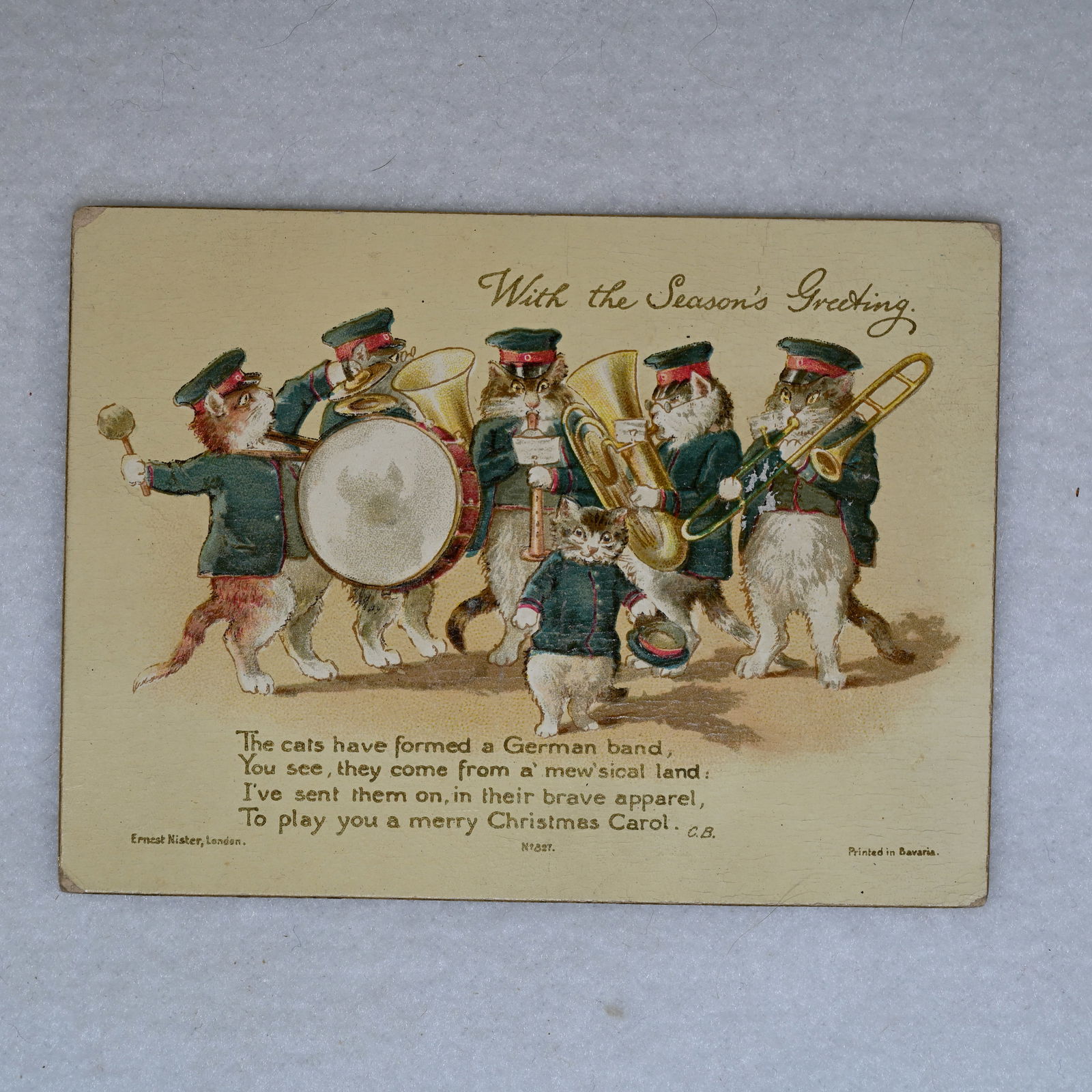 Season s Greetings - The cats have formed a German Band: Greeting card. Lower left: Ernest Nister, London. Lower right: Printed in Bavaria.