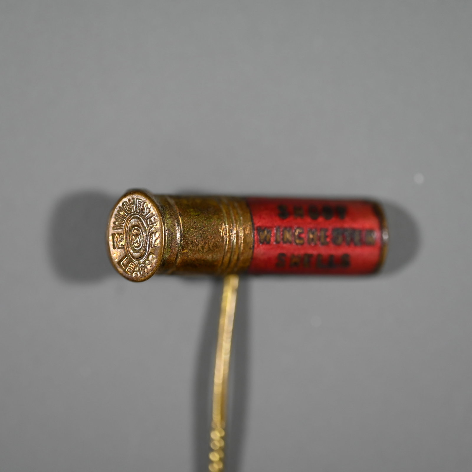 Shoot Winchester Shells Advertising Stick Pin: Shoot Winchester Shells Enamel Stick Pin. Red version. About 2 inches tall x 1 inch wide (the shell) x 1/8th inches deep.