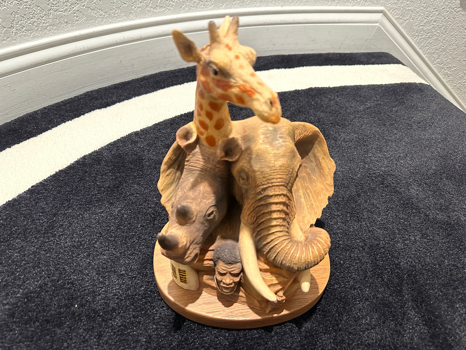 J.H. Boone 1994 Sculpture titled Savanna Titans: J.H. Boone 1994 Sculpture titled Savanna Titans signed and numbered 124 of 2500. Measures approximately 11 1/2 inches tall by 10 1/2 inches wide by 7 inches deep. The sculpture is on a wood base and f