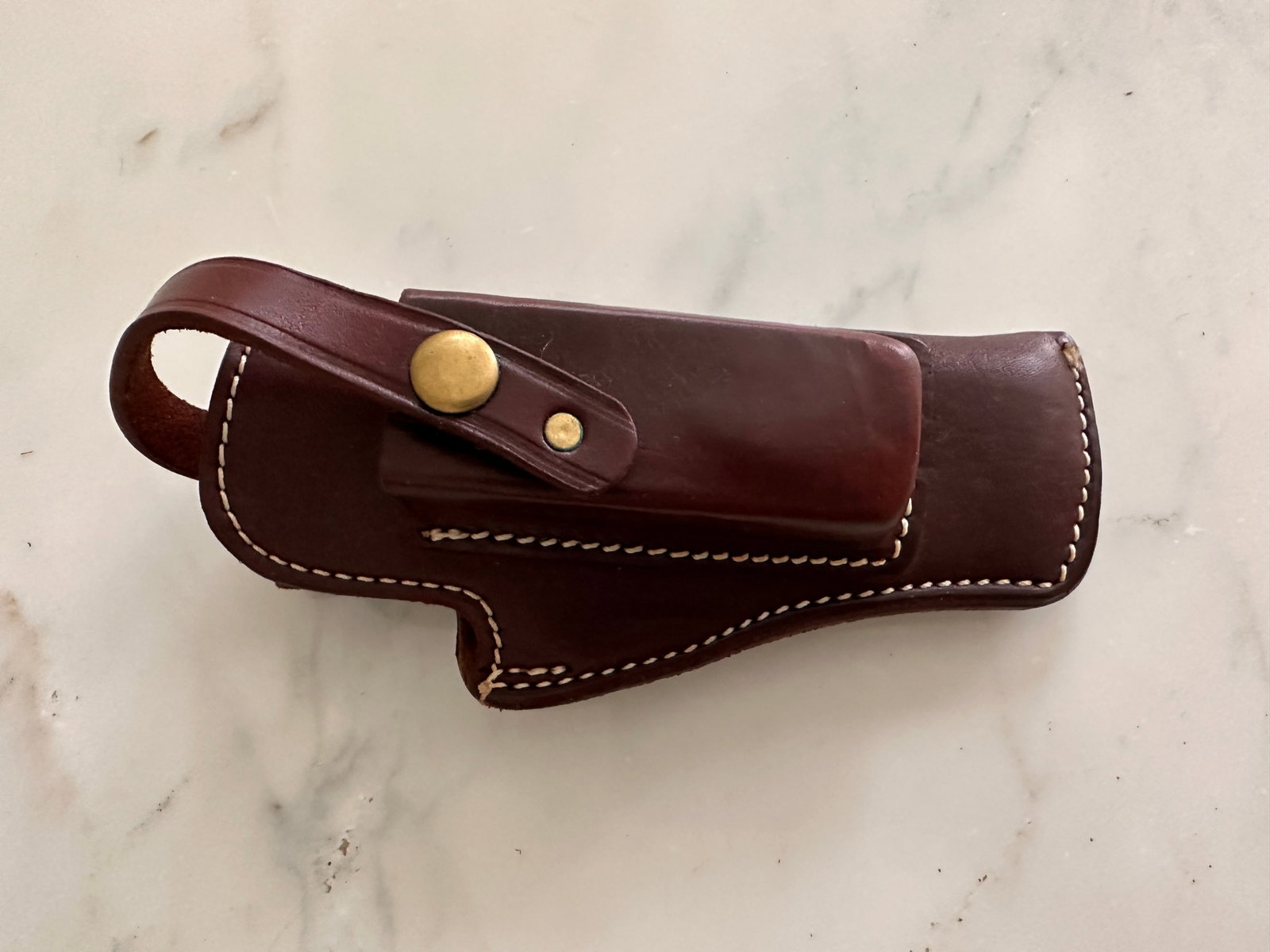 Leather holster: Leather holster that is approximately 8 1/2 inches long by 4 inches wide by 3 inches thick Marked K 39-17B.