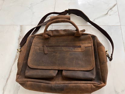 Leather Messenger Bag: Leather Messenger Bag that is approximately 19 inches long by 14 inches tall by 3 inches thick. To us, this is just as functional as a Chanel Graffiti Tweed & Khaki Toile Messenger Bag, Louis Vuitton
