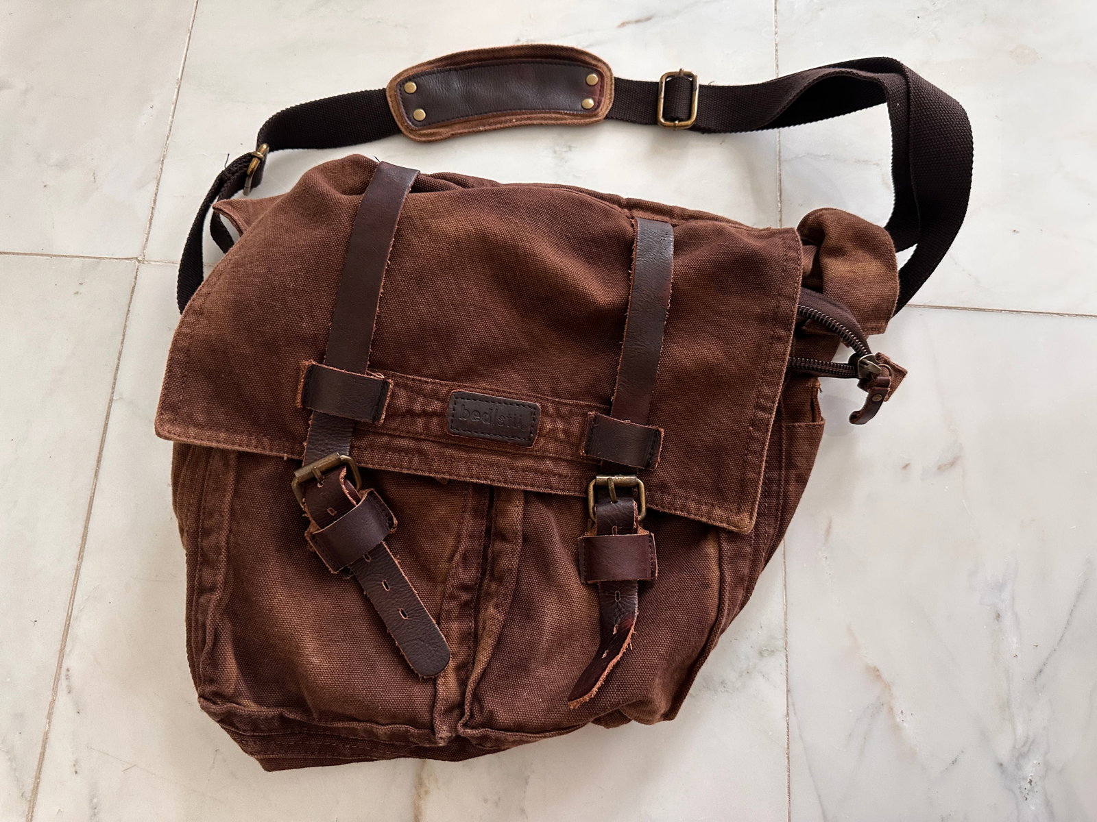 BedStu Canvas Shoulder Bag DISCONTINUED AND HARD TO FIND: BedStu Canvas Shoulder Bag that is approximately 15 inches long by 12 inches tall by 4 inches thick. This model is discontinued and hard to find. This was not a cheap bag when it was new. To put this 
