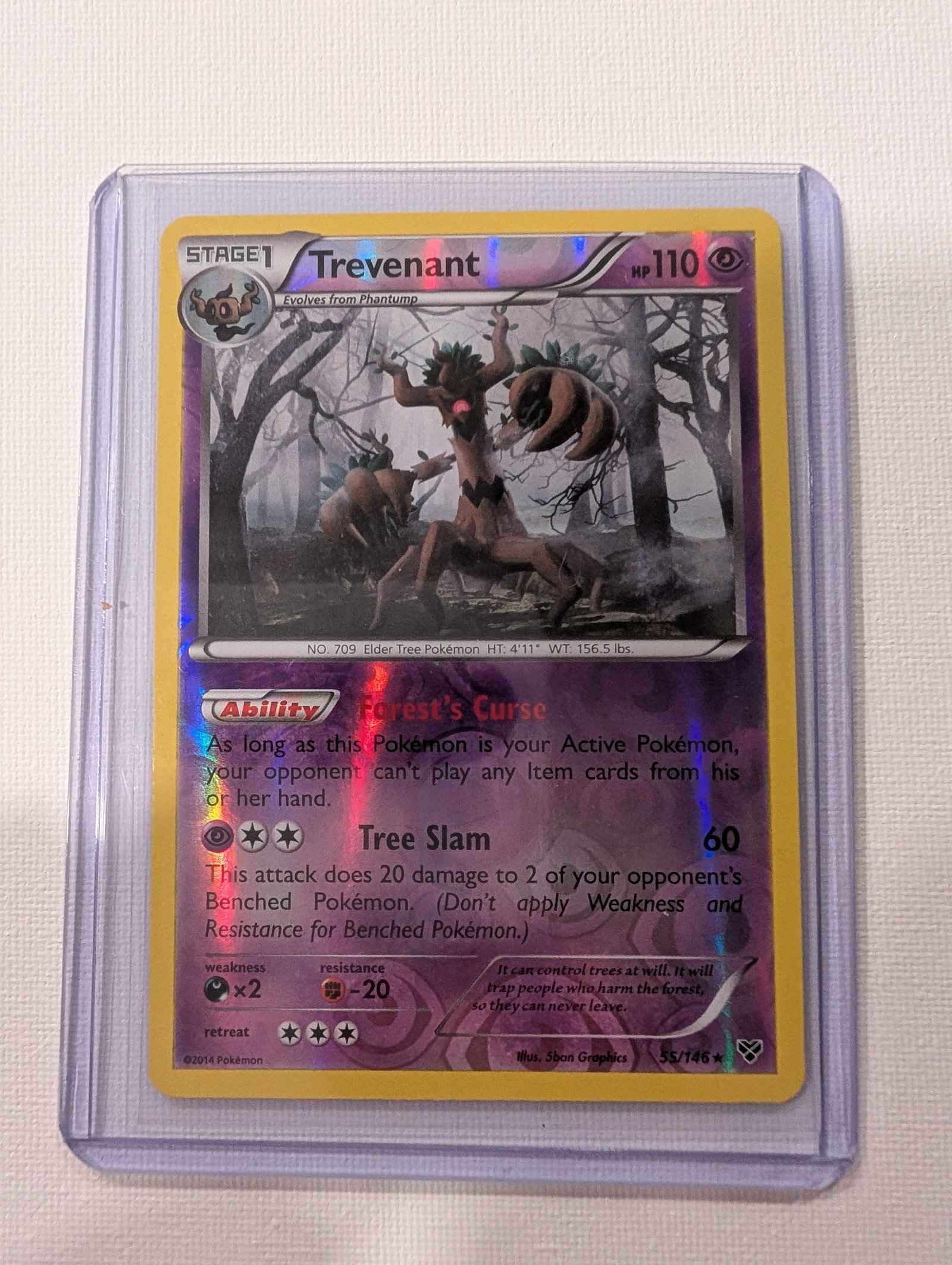 2014 Pokemon Trevenant 55 146 XY Base Set Holo Rare.: This lot is a Trevenant Holo Rare card numbered 55 146 from the 2014 XY expansion. It is a Psychic type Stage 1 Pokemon with 110 HP that evolves from Phantump and features artwork by 5ban Graphics.