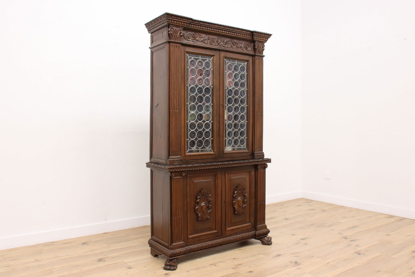 Italian Renaissance Antique Walnut China Cabinet or Bookcase #47038: This Italian Renaissance design back bar, china cabinet, or bookcase has two panes of beautiful leaded and textured bottle or Rondel blown glass. Italian 1880s antique furniture. Deeply hand-carved so