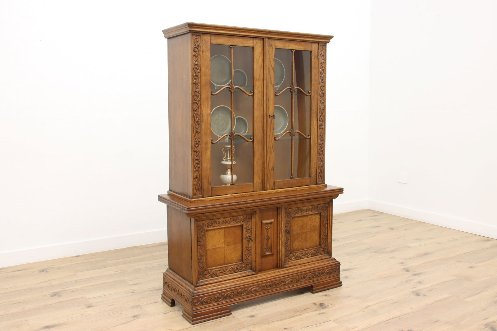 Scandinavian Antique Oak China or Curio Display Cabinet #45160: An oak antique china or curio display cabinet has beautiful carved detailing. Scandinavian Antique 1920s furniture. Quarter sawn oak.Top surface has been refinished for durability. The rest of the ori